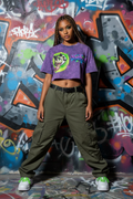 JuneBug women's cropped acid wash purple graphic tee with graffiti logo on the front, shown from the front