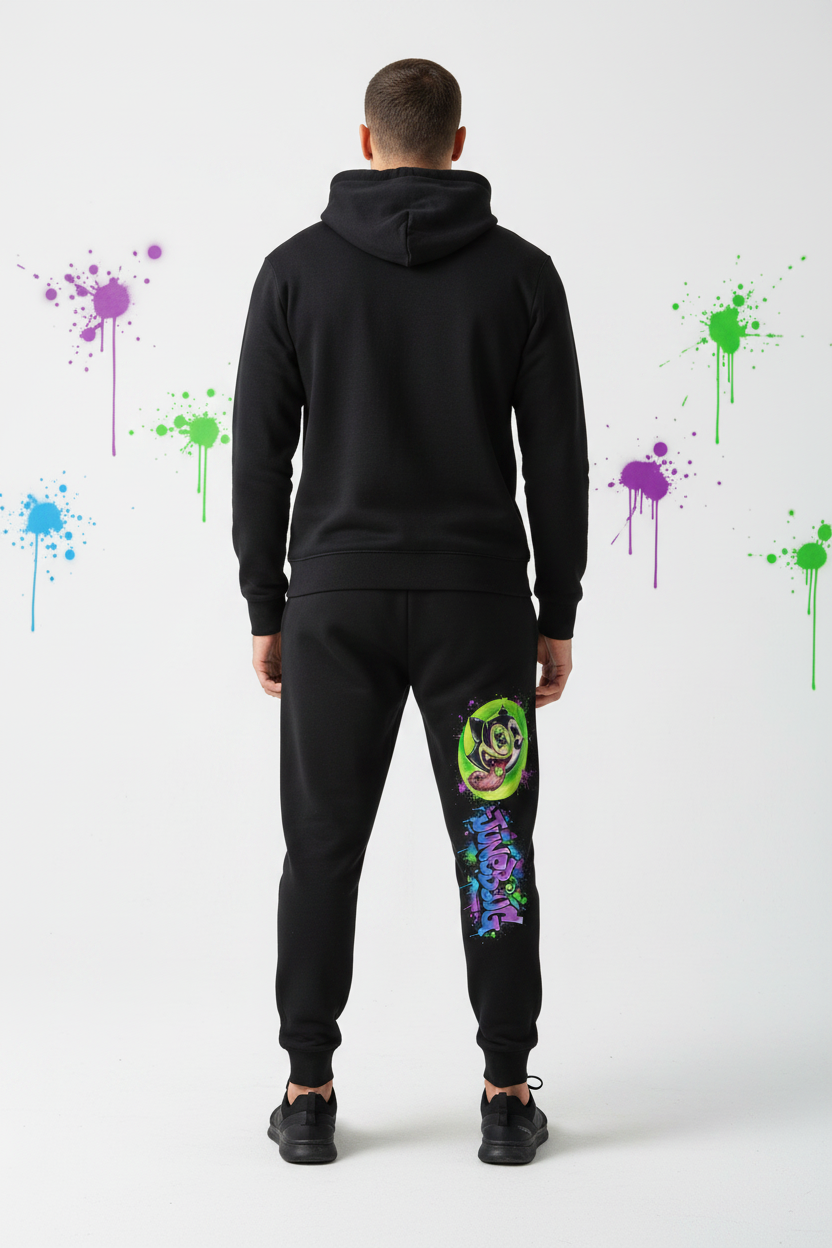 Close-up of JuneBug black jogger pants featuring elastic cuffs and bold graffiti logo detail on the leg